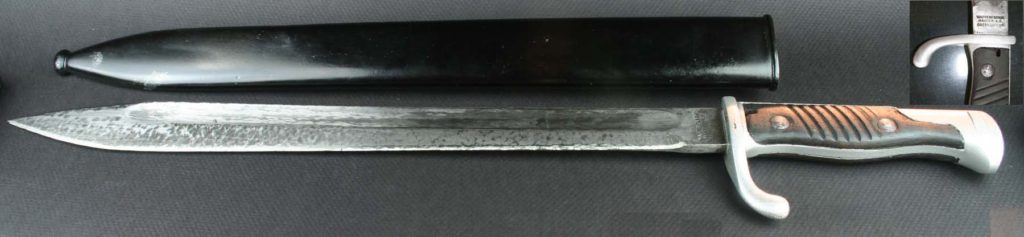 The German 1898/1905 “Butcher Blade” bayonet was the most common bayonet used by the German Heer during WWI, it was called the “Butcher Blade” by the Allies because of its shape. Designed to fit the 1898 German Mauser Carbines and Rifles. This 98/05 bayonet was manufactured by Simson & Co., Suhl, Germany.